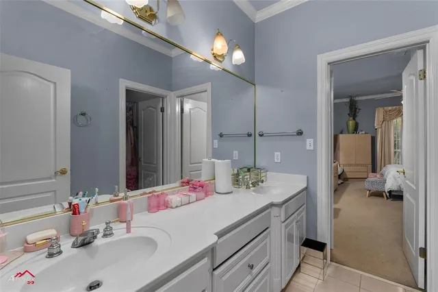 a bathroom with a sink vanity and a mirror
