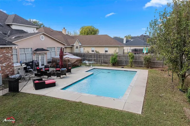 a view of a house with swimming pool