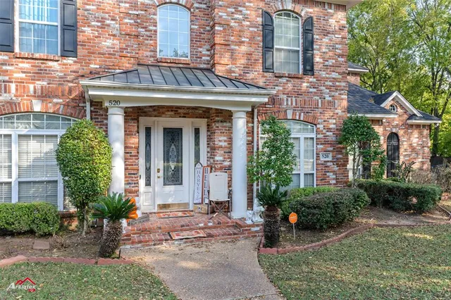 a view of a building with potted plants