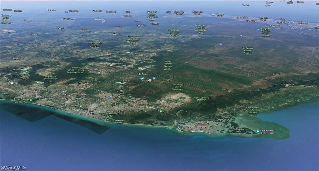 , No Street Naples, FL 34117 - Photo 6 of 8 a view of a green field