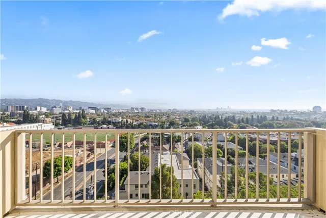 a view of a balcony with city view