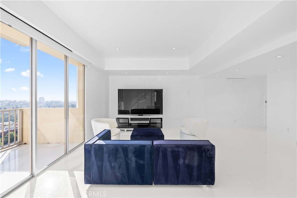 2160 Century Park East, Unit 902 Los Angeles, CA 90067 - Photo 17 of 51 a living room with furniture and a flat screen tv