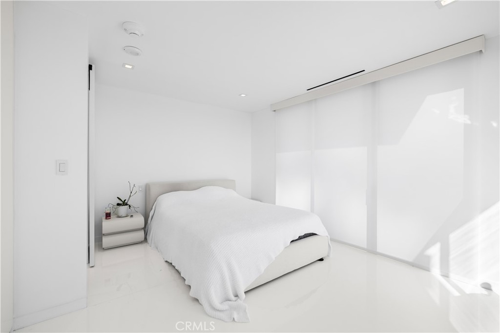 2160 Century Park East, Unit 902 Los Angeles, CA 90067 - Photo 21 of 51 a bedroom with a bed and a shower