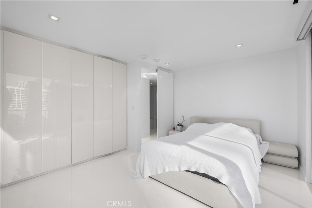 2160 Century Park East, Unit 902 Los Angeles, CA 90067 - Photo 27 of 51 a bedroom with a bed and a closet