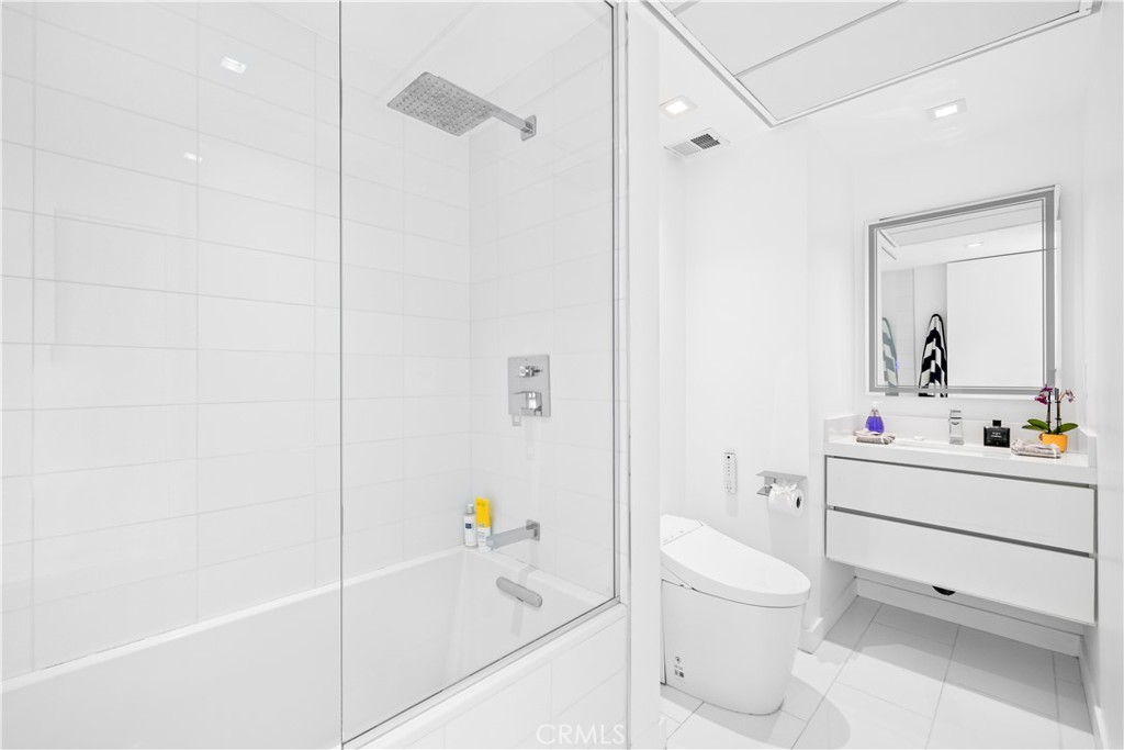 2160 Century Park East, Unit 902 Los Angeles, CA 90067 - Photo 28 of 51 a bathroom with a bathtub a sink a toilet and a shower