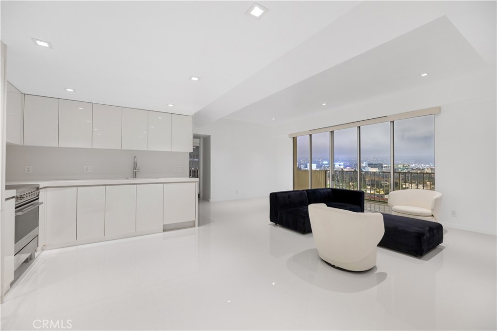 2160 Century Park East, Unit 902 Los Angeles, CA 90067 - Photo 6 of 51 a living room with furniture a window and a kitchen view