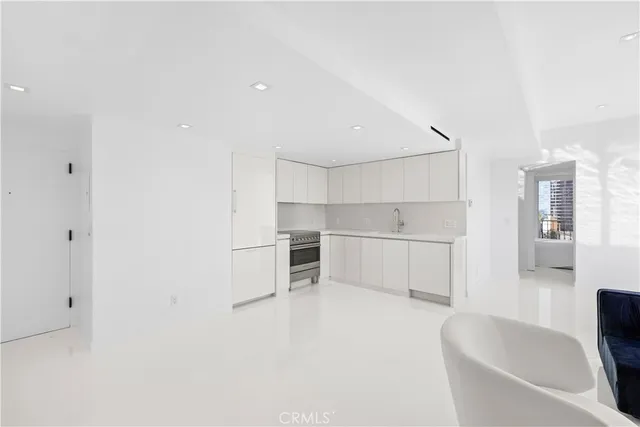 a kitchen with a sink and a stove