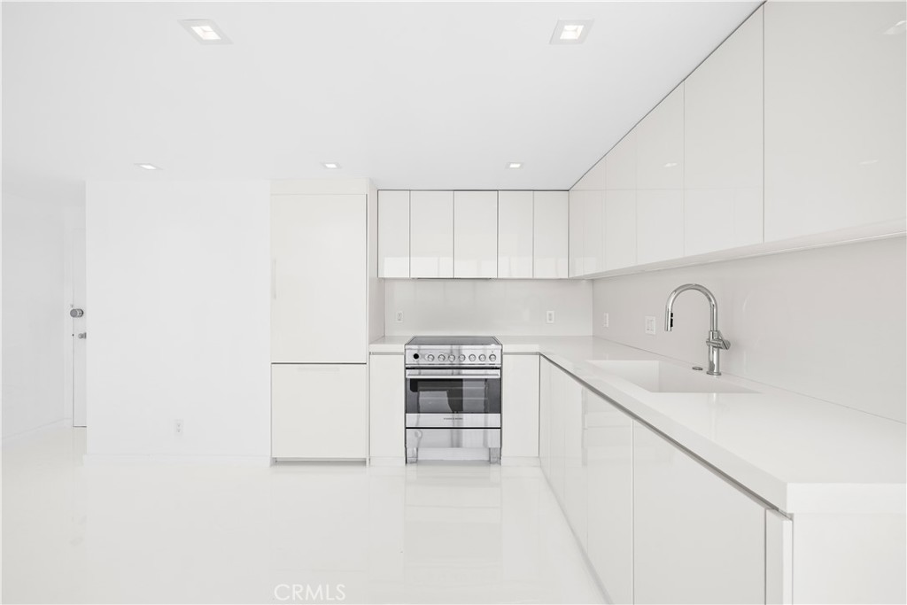 2160 Century Park East, Unit 902 Los Angeles, CA 90067 - Photo 9 of 51 a kitchen with a sink and a stove