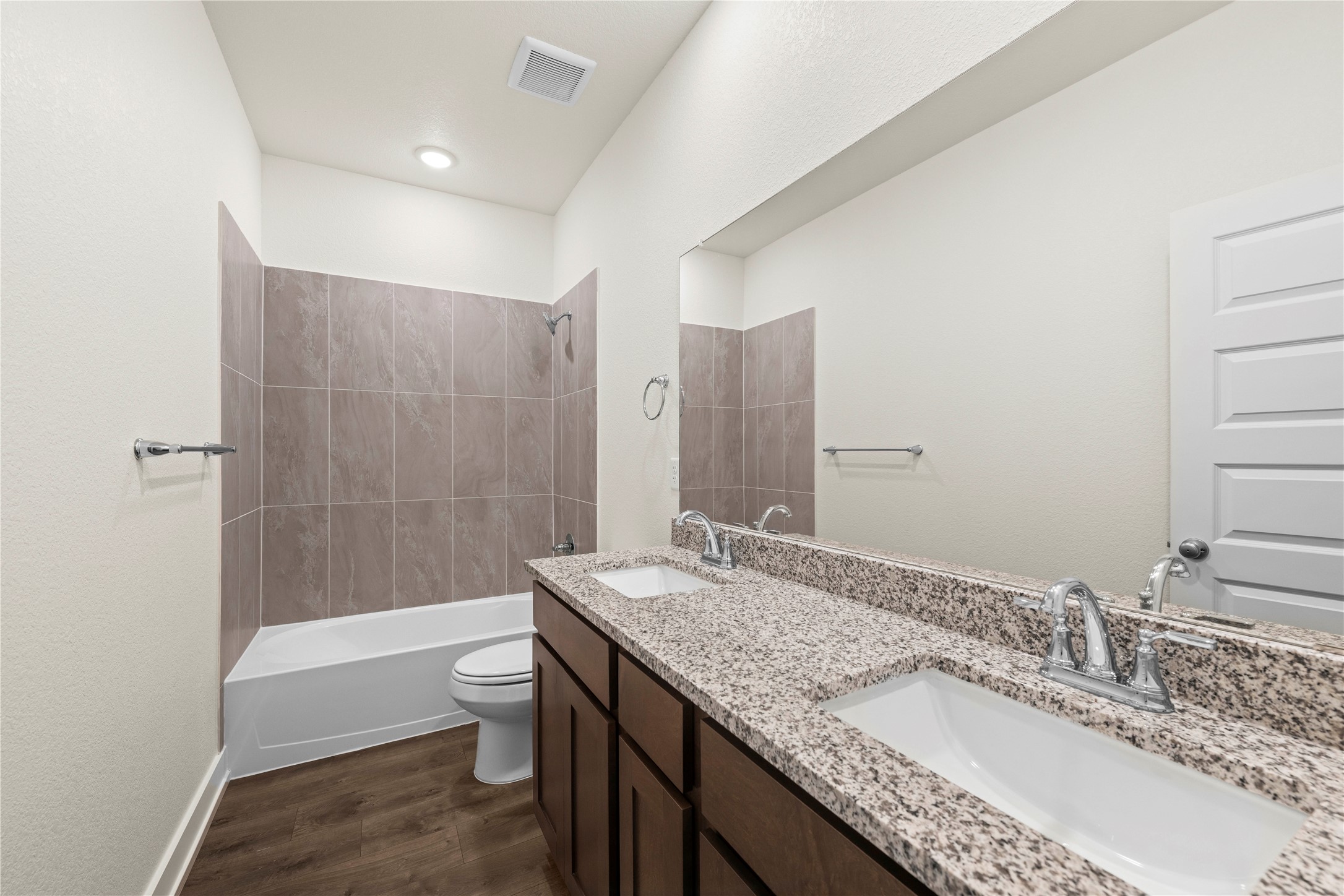 552 Gus Loop Georgetown, TX 78626 - Photo 20 of 23 a bathroom with a granite countertop sink a toilet and shower