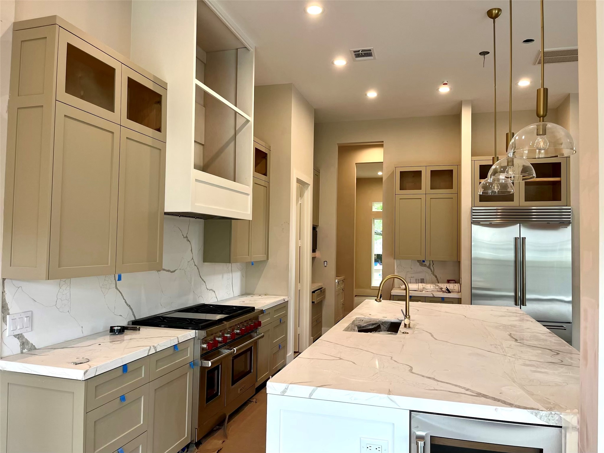 4623 Verone Street Bellaire, TX 77401 - Photo 3 of 8 a kitchen with stainless steel appliances granite countertop a stove a sink and a refrigerator