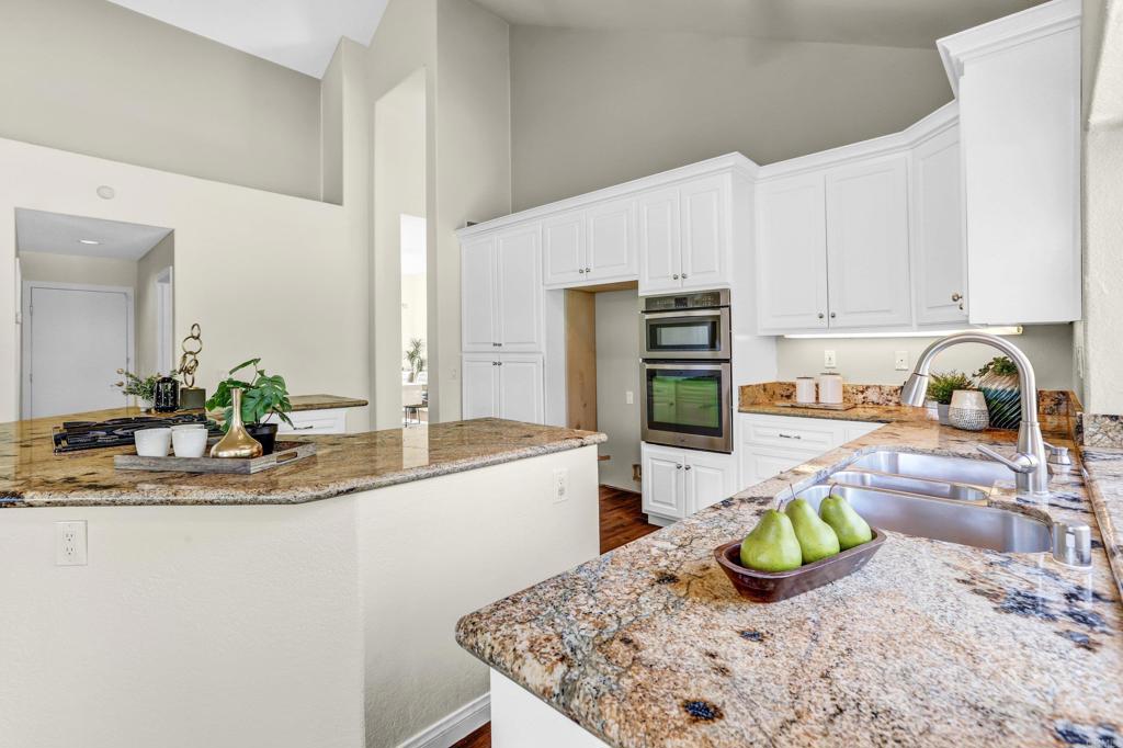 12236 Malabar Drive Poway, CA 92064 - Photo 16 of 32 a kitchen with a sink and a white cabinets