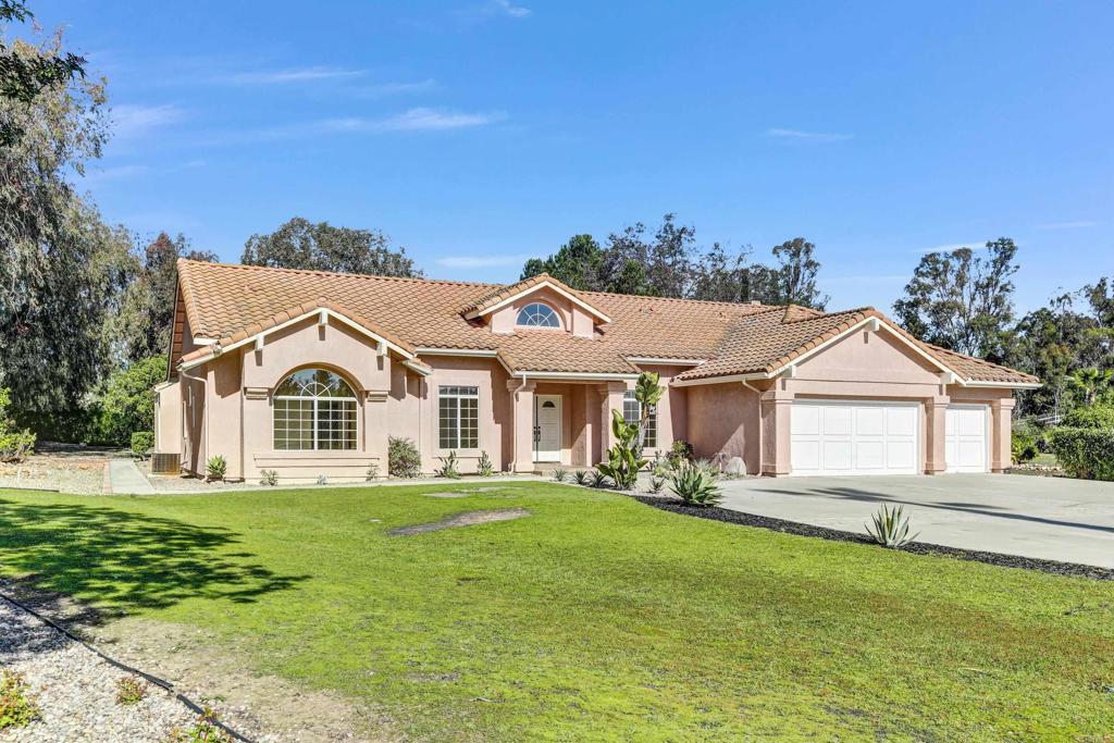12236 Malabar Drive Poway, CA 92064 - Photo 2 of 32 a front view of a house with a yard