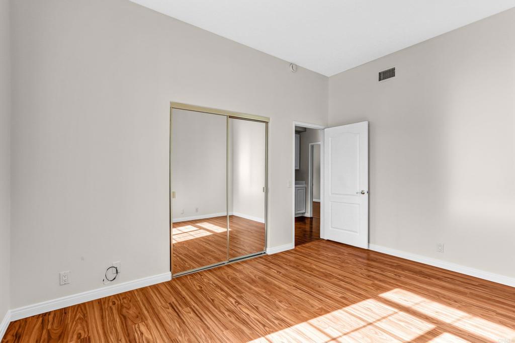 12236 Malabar Drive Poway, CA 92064 - Photo 23 of 32 a bedroom with a bed and a window