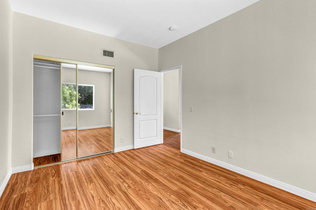 12236 Malabar Drive Poway, CA 92064 - Photo 25 of 32 a view of empty room with wooden floor