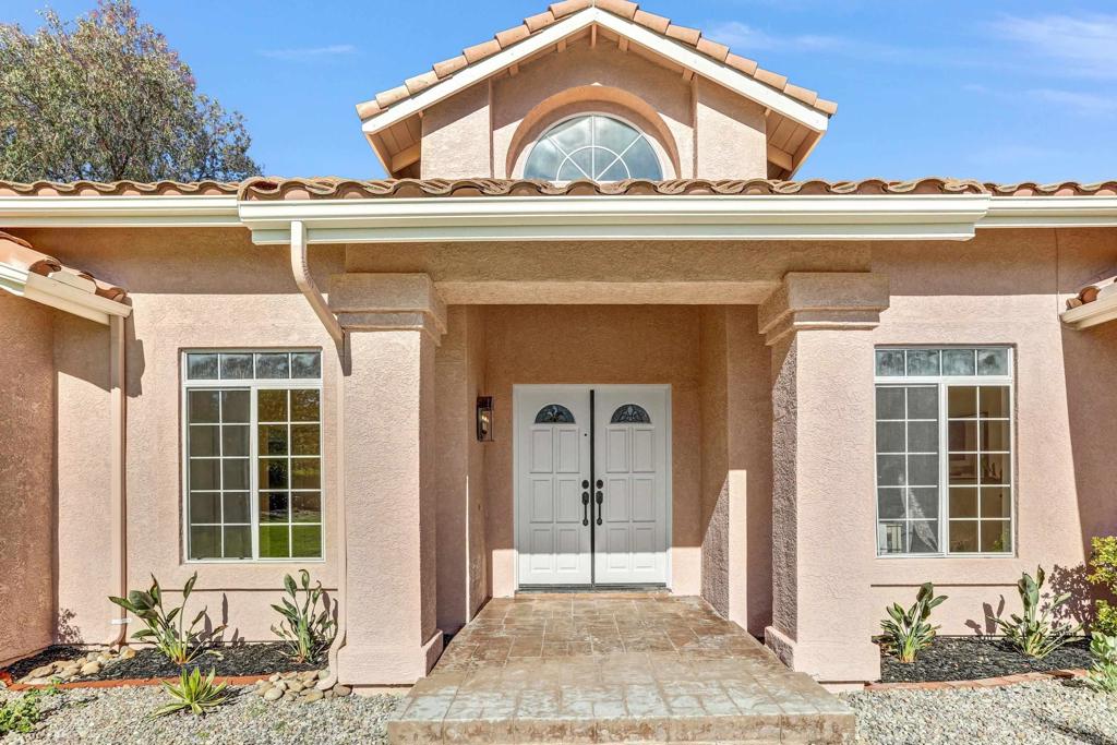 12236 Malabar Drive Poway, CA 92064 - Photo 4 of 32 a front view of a house with a yard