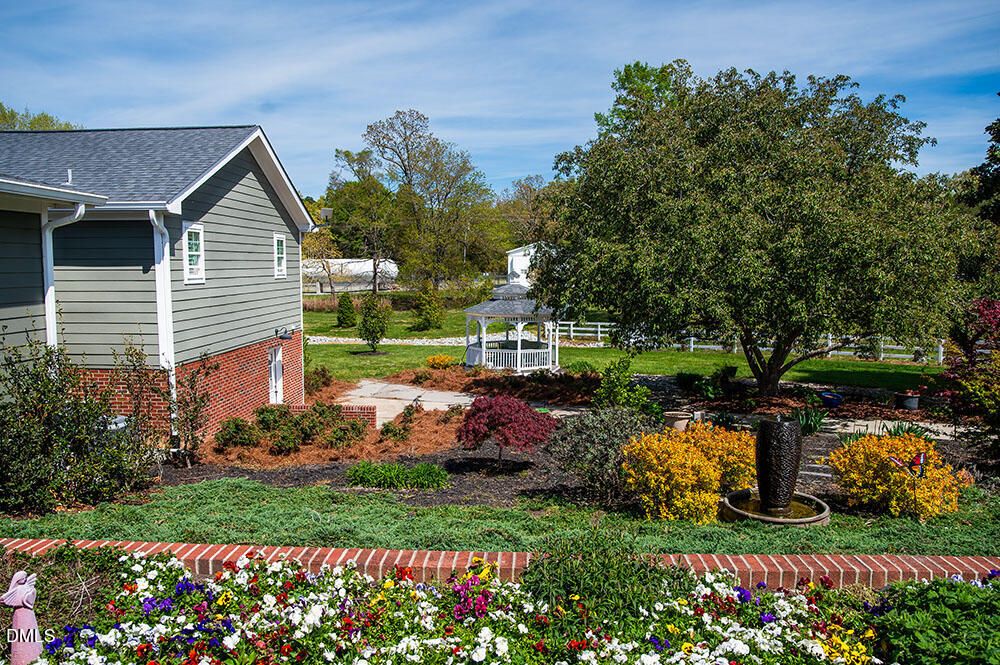 75 Frank Timberlake Road Timberlake, NC 27583 - Photo 63 of 93 a view of a house with a backyard and garden