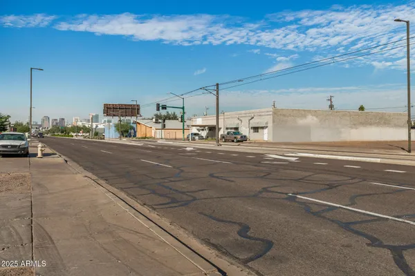 a view of a road with an ocean