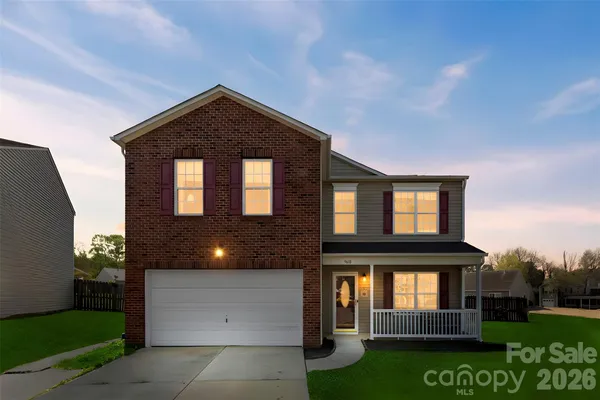 a front view of a house with yard