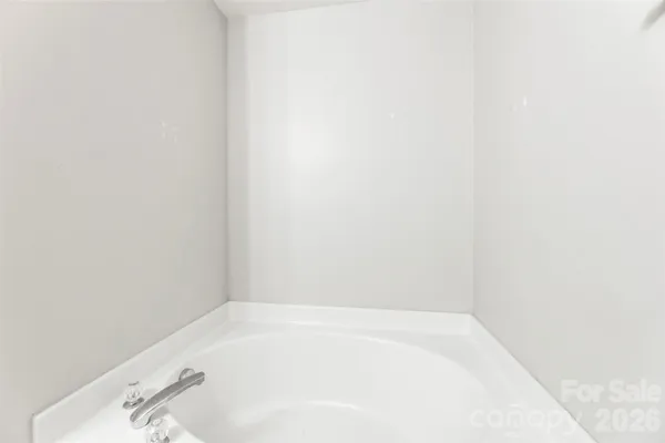 a white bath tub sitting in a bathroom