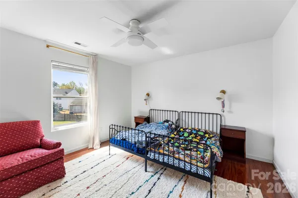 a bedroom with furniture and a window