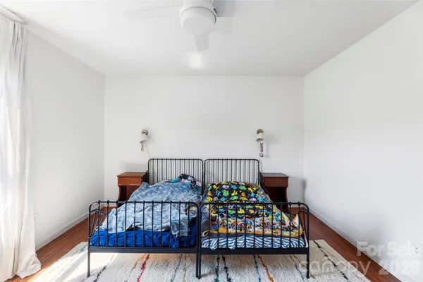 a bedroom with furniture and a window