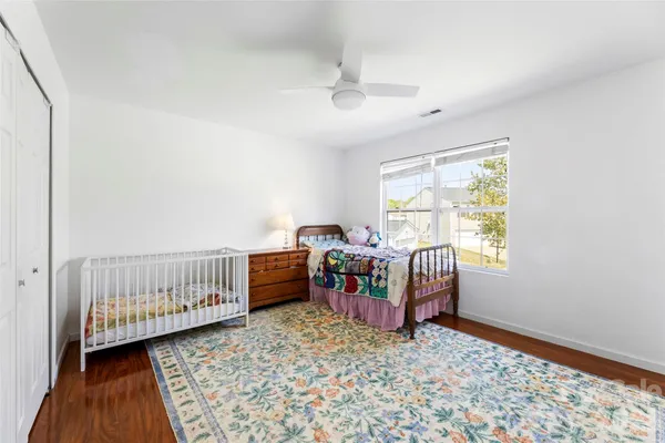 a bedroom with furniture and a window