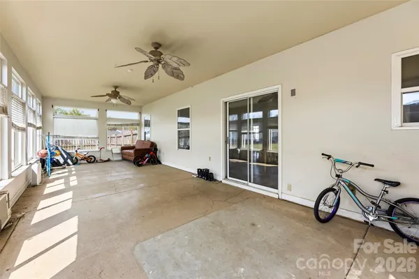 a view of a livingroom with furniture and a window