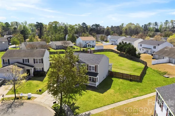 a view of a swimming pool with a yard