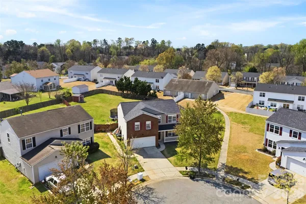 an aerial view of a house with a garden