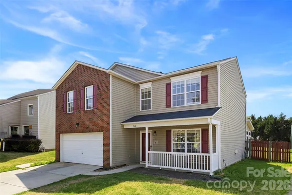 a view of porch with a small yard