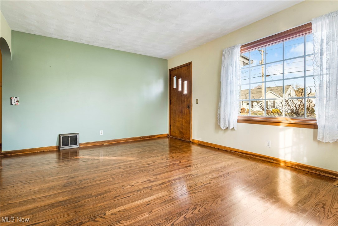 4870 15th Street Southwest Canton, OH 44710 - Photo 5 of 36 Living room featuring hardwood floors and large windows for natural light