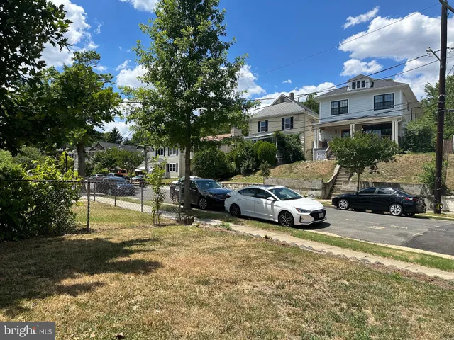 a view of street with parked cars