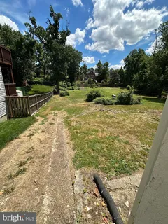 a view of a yard with an outdoor space