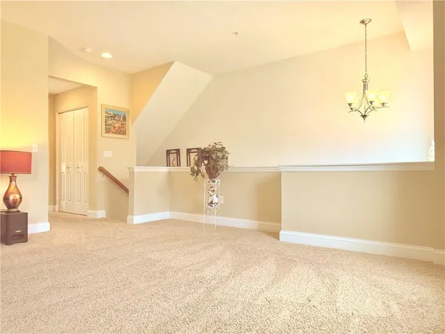 a view of an entryway with wooden floor and stairs