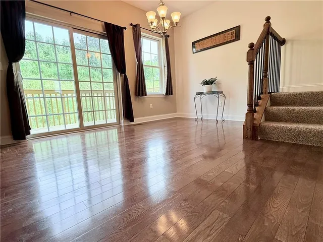 a bathroom with a shower and a glass door