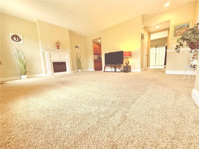 a view of a kitchen with granite countertop cabinets