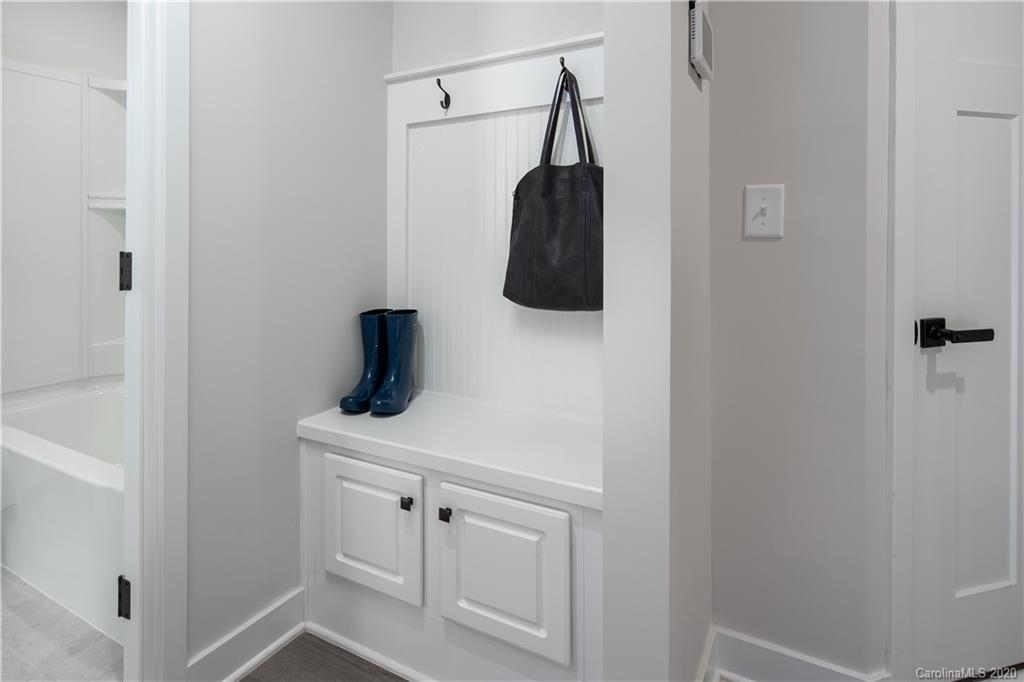 618 Crudent Road, Unit 1004C Tega Cay, SC 29708 - Photo 2 of 12 a bathroom with a sink and a mirror