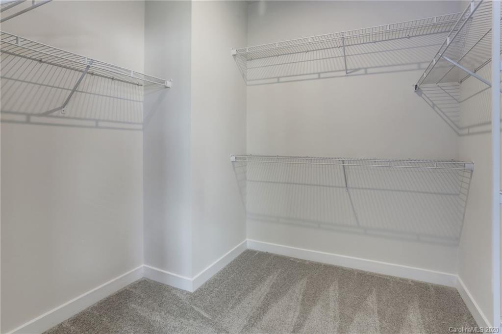618 Crudent Road, Unit 1004C Tega Cay, SC 29708 - Photo 10 of 12 a view of a room with racks on the wall