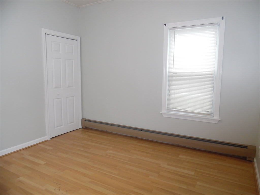 1226 North Main Street, Unit 1 Fall River, MA 02720 - Photo 4 of 10 an empty room with a window