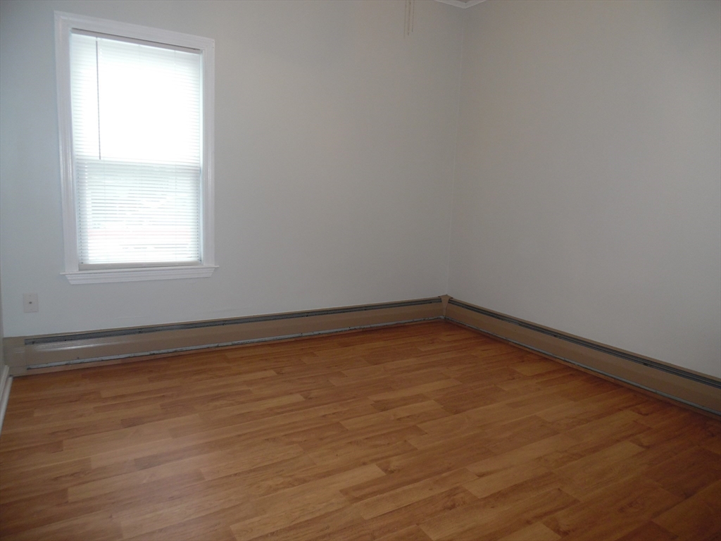 1226 North Main Street, Unit 1 Fall River, MA 02720 - Photo 5 of 10 an empty room with a window
