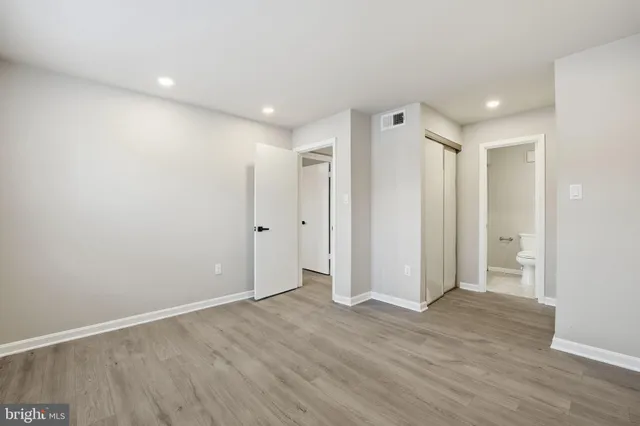 a view of hallway with wooden floor