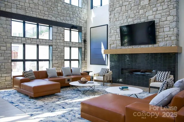 a outdoor living space with furniture and a fireplace