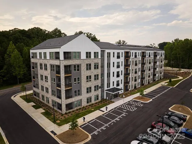 a view of a large building with a street