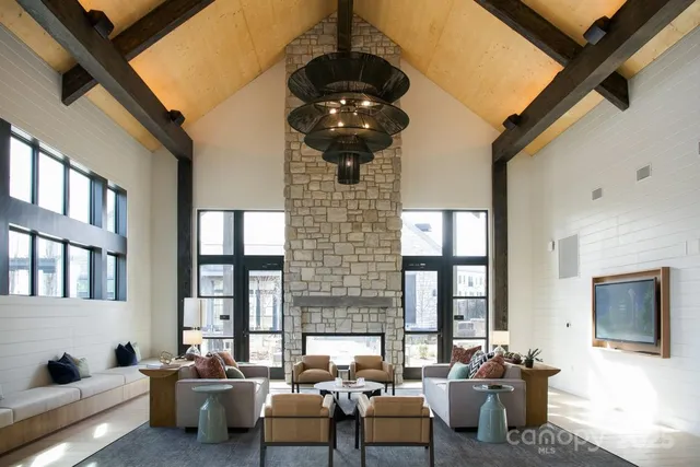 a kitchen with stainless steel appliances a stove a sink and a microwave