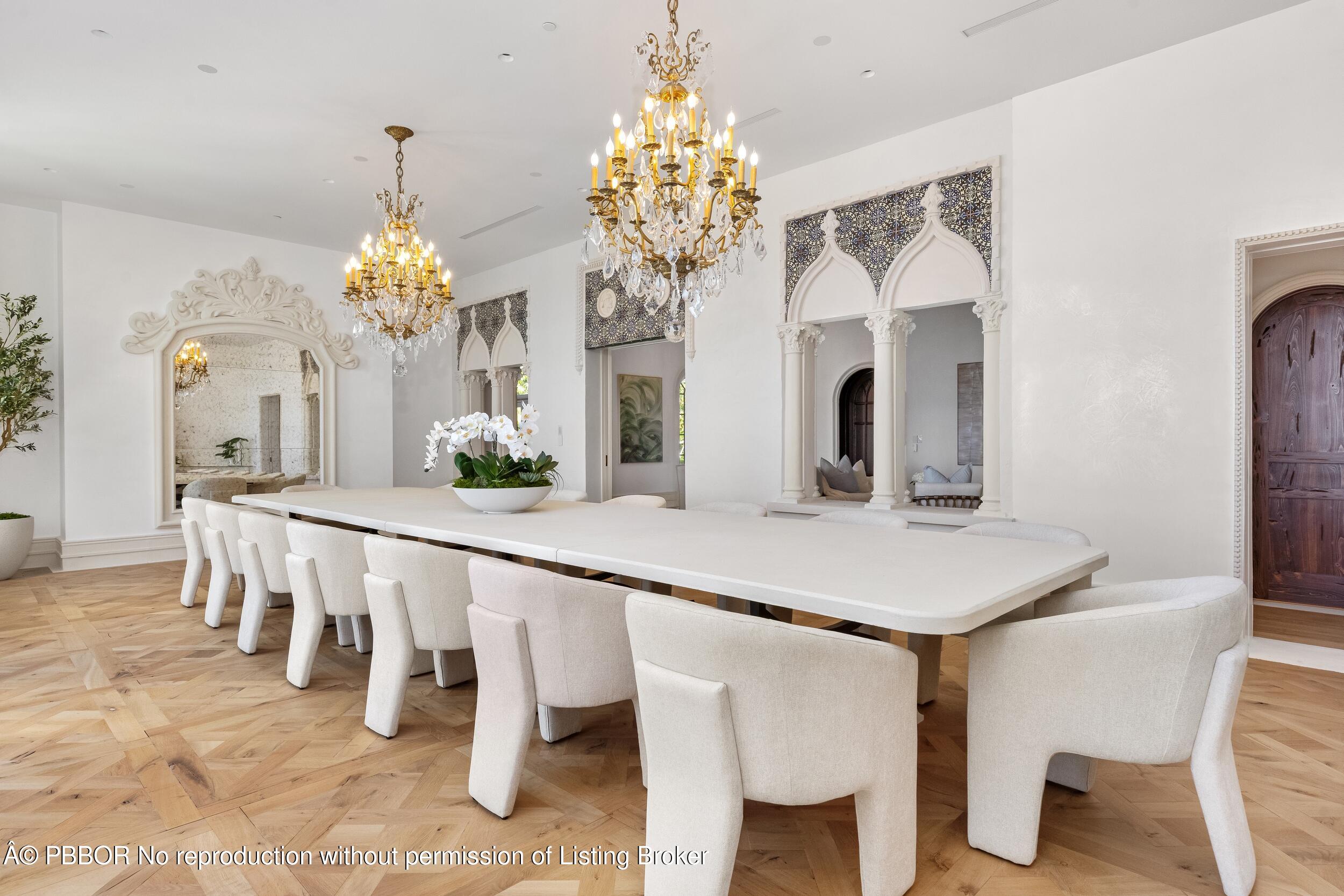 800 South County Road Palm Beach, FL 33480 - Photo 40 of 76 a dining room with furniture and chandelier