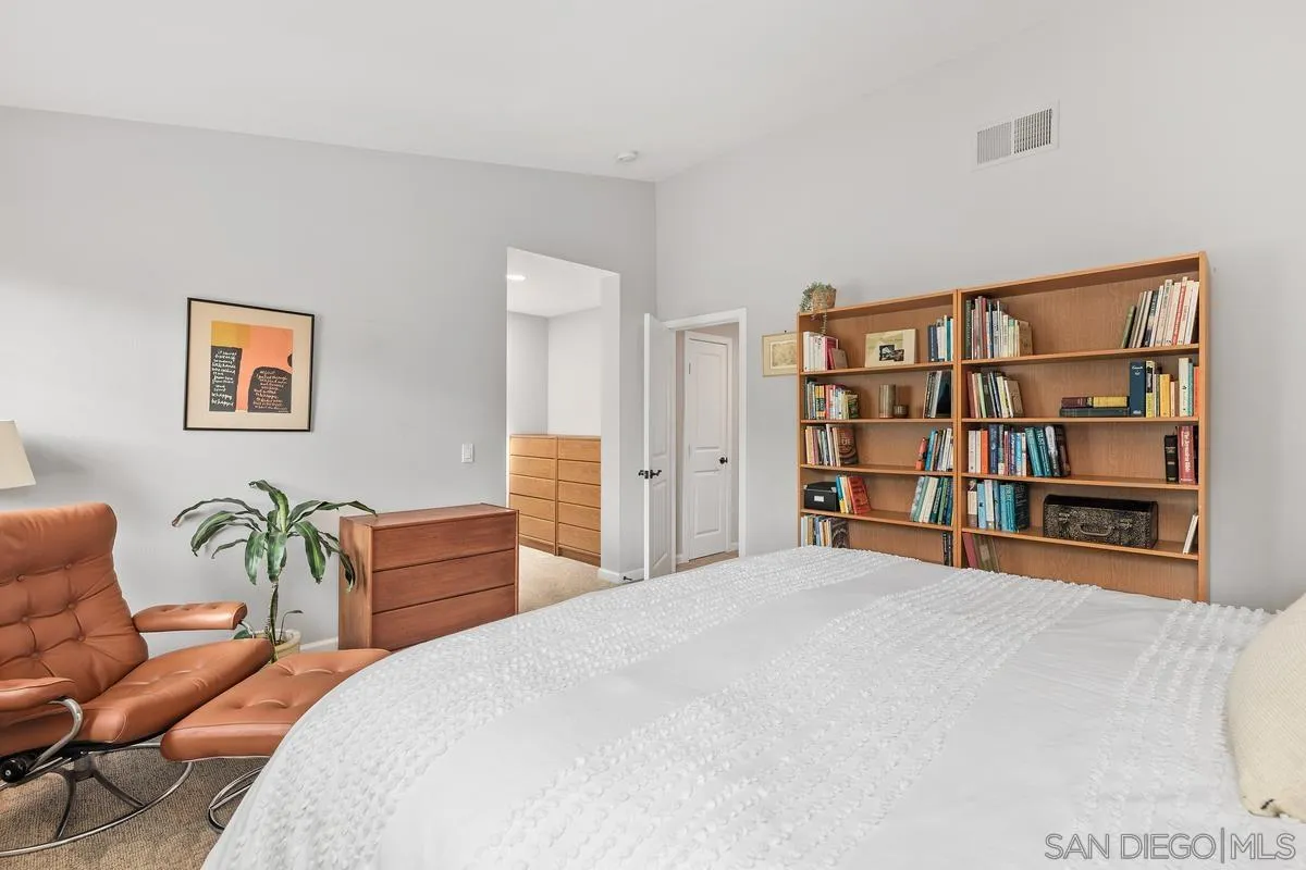 2206 Summerhill Drive Encinitas, CA 92024 - Photo 23 of 33 a bedroom with a bed and furniture