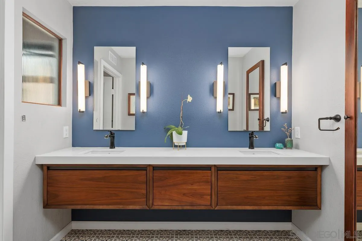 2206 Summerhill Drive Encinitas, CA 92024 - Photo 25 of 33 a bathroom with a sink and a mirror