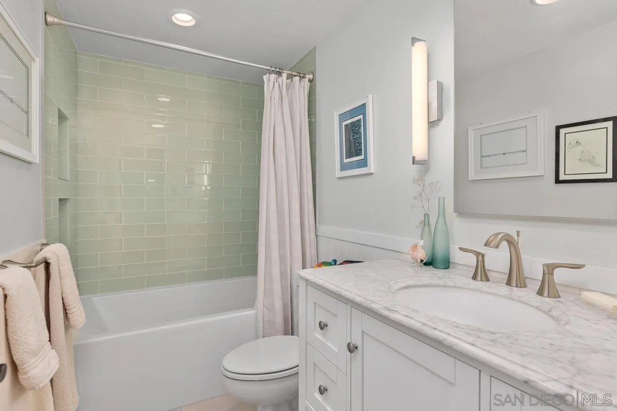 2206 Summerhill Drive Encinitas, CA 92024 - Photo 29 of 33 a bathroom with a granite countertop sink toilet and shower