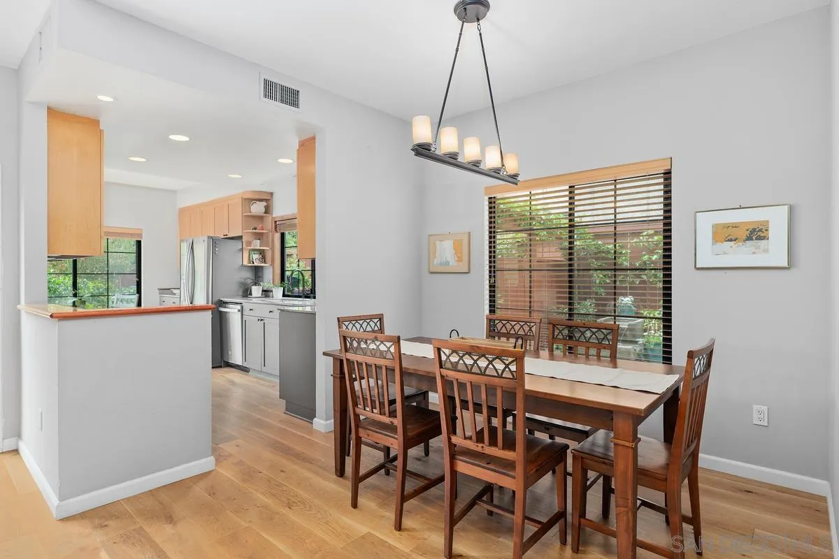 2206 Summerhill Drive Encinitas, CA 92024 - Photo 4 of 33 a view of a dining room with furniture window and wooden floor