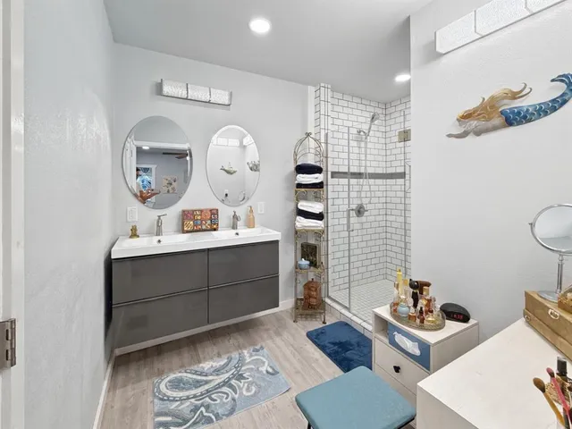 a living room with furniture and a mirror